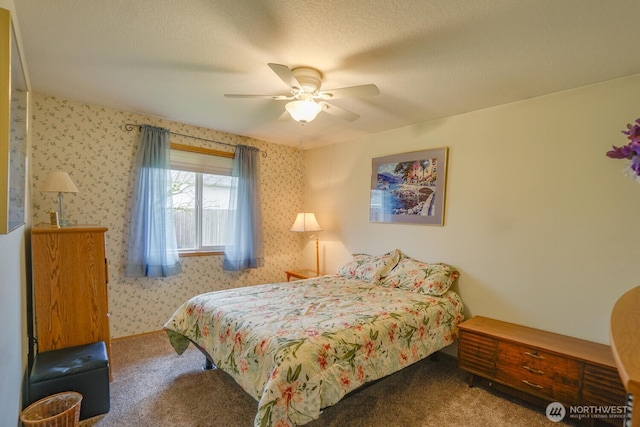 bedroom featuring a textured ceiling, ceiling fan, carpet, and wallpapered walls