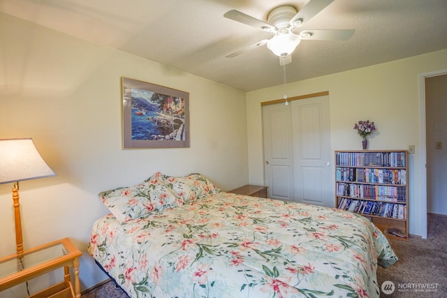 bedroom featuring a textured ceiling, a ceiling fan, a closet, and carpet flooring