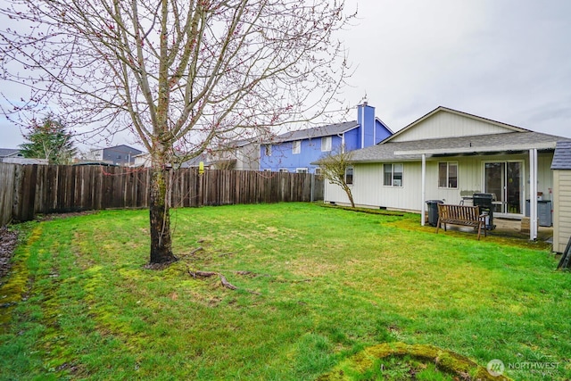 view of yard with a fenced backyard