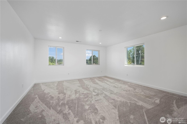 empty room with recessed lighting, carpet flooring, and baseboards