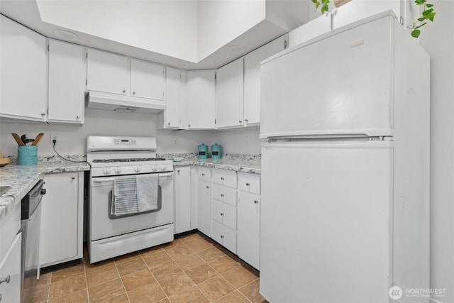 kitchen with white appliances, under cabinet range hood, and white cabinetry