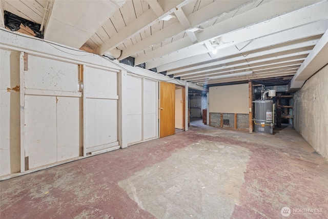 unfinished basement with water heater