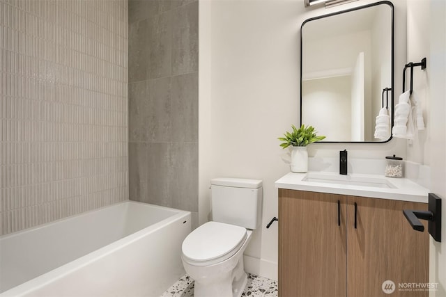 bathroom with toilet,  shower combination, and vanity