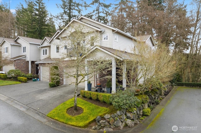 view of front facade with an attached garage and concrete driveway