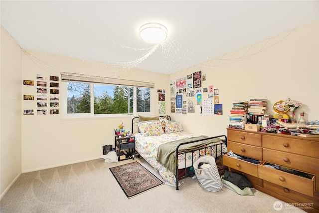 bedroom featuring carpet floors and baseboards