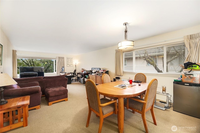 dining space with light carpet