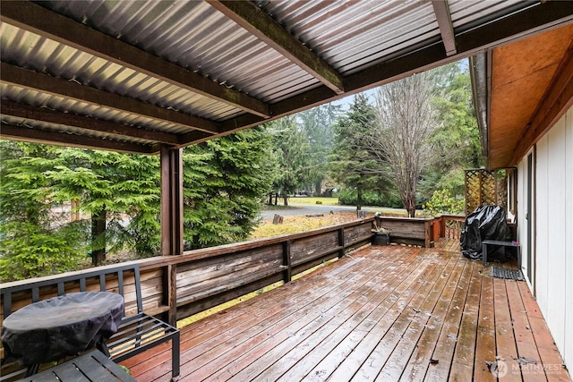 wooden deck featuring area for grilling