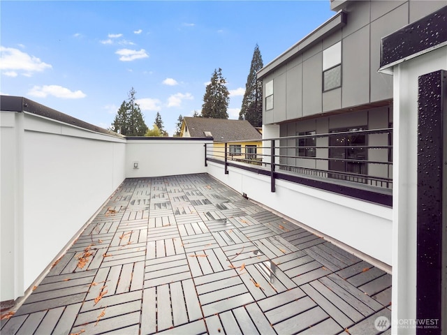 view of patio featuring a balcony