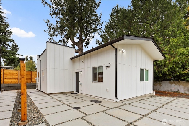 back of house featuring a patio area and fence