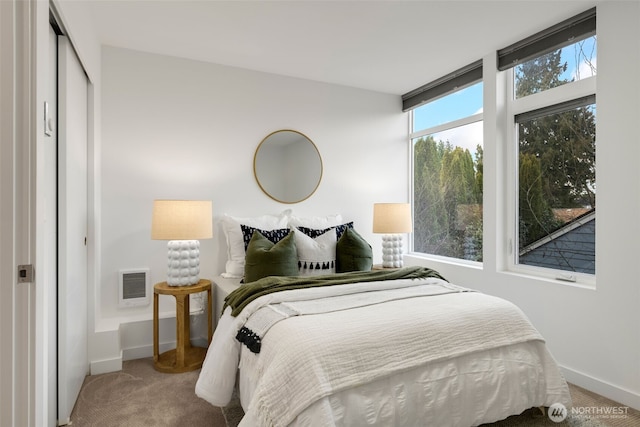 bedroom featuring carpet, visible vents, and baseboards