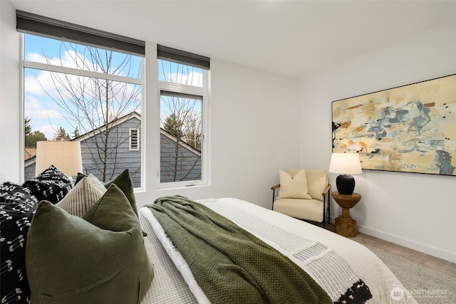 bedroom featuring carpet flooring and baseboards