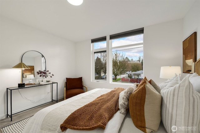 bedroom featuring carpet flooring and baseboards