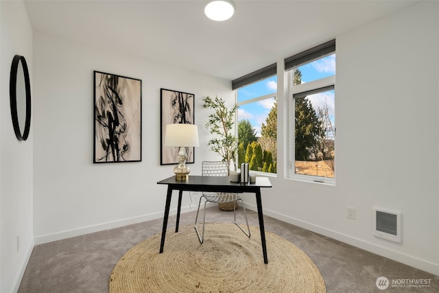 office area with carpet floors, visible vents, and baseboards