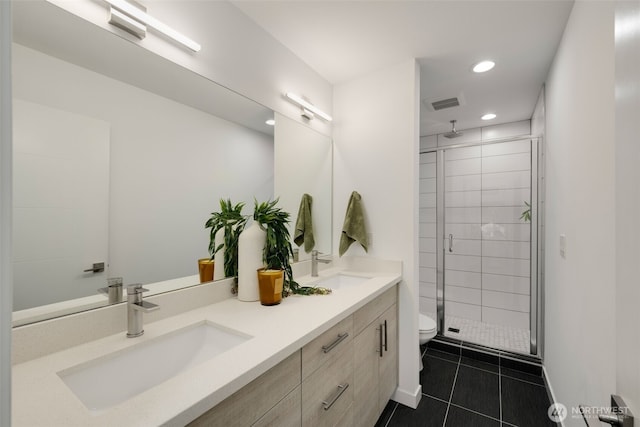 bathroom featuring a sink, visible vents, tile patterned floors, double vanity, and a stall shower