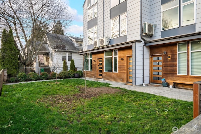 exterior space with fence and a lawn