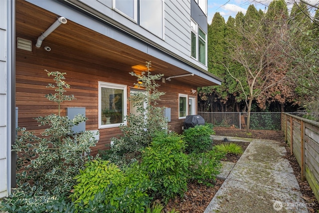 view of side of property with a fenced backyard