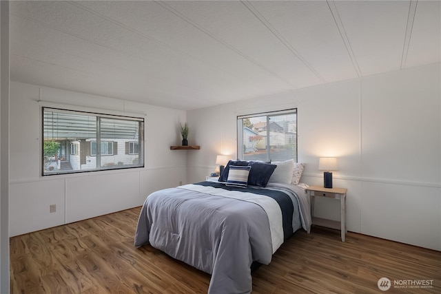 bedroom with wood finished floors