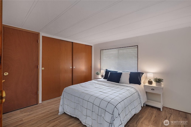 bedroom with a closet and wood finished floors