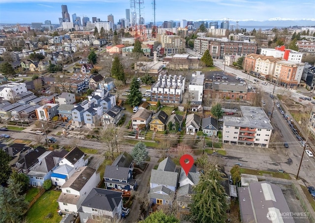 birds eye view of property with a view of city