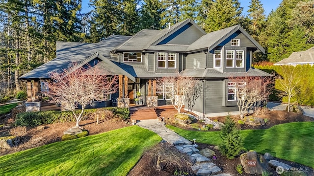 craftsman-style home featuring a front yard