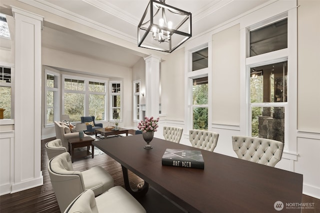 home office with ornamental molding, dark wood-type flooring, decorative columns, and a decorative wall