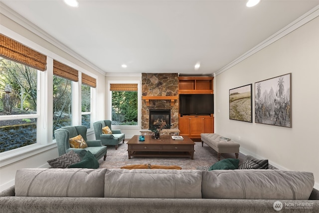 living area featuring recessed lighting, a fireplace, crown molding, and baseboards