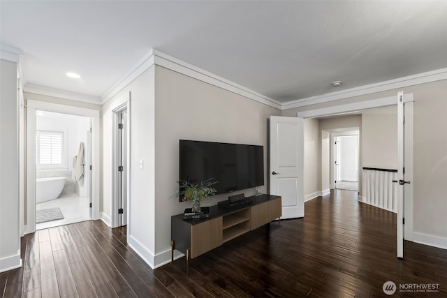 living area with dark wood-type flooring, ornamental molding, and baseboards