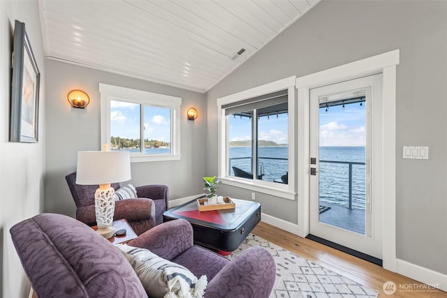1831 Miracle Mile Dr E, Port Orchard, WA 98366 - sitting room featuring a water view, light wood-style floors, baseboards, and lofted ceiling