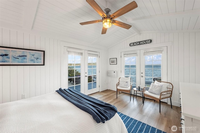 1831 Miracle Mile Dr E, Port Orchard, WA 98366 - bedroom with french doors, a water view, light wood-style flooring, lofted ceiling with beams, and access to outside