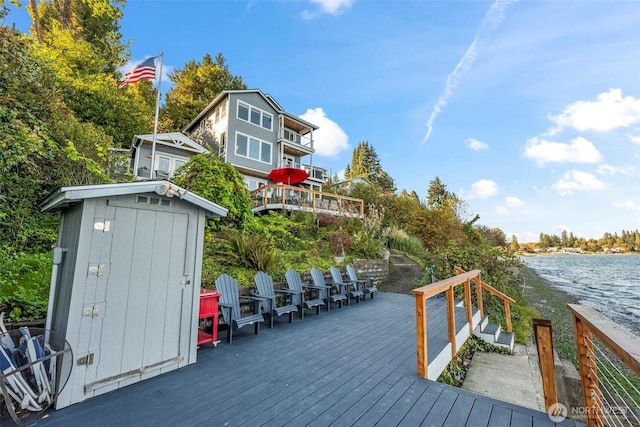 1831 Miracle Mile Dr E, Port Orchard, WA 98366 - wooden deck with an outbuilding, a shed, and a water view