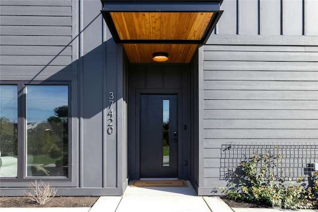 property entrance with board and batten siding