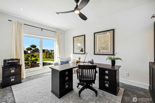 office area featuring ceiling fan and baseboards