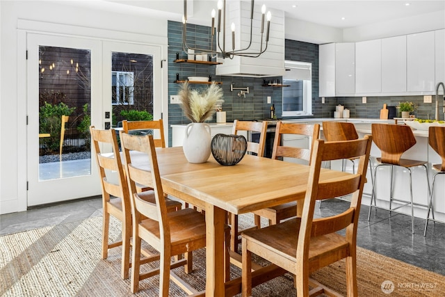 dining space featuring a chandelier