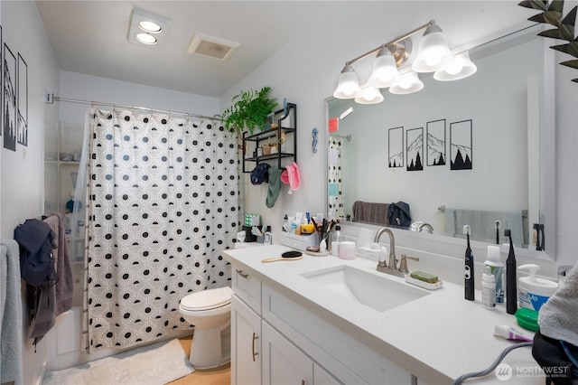 bathroom with vanity, toilet, and shower / bathtub combination with curtain