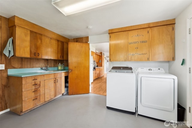 4421 89th Ave SE, Olympia, WA 98501 - clothes washing area with a sink, cabinet space, and washing machine and clothes dryer