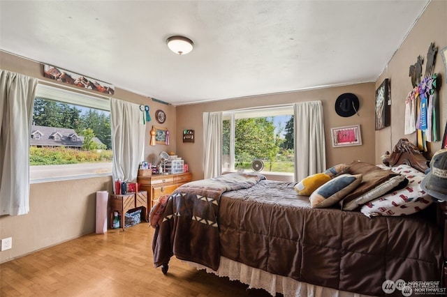 4421 89th Ave SE, Olympia, WA 98501 - bedroom with light wood-style floors and crown molding