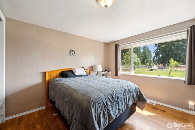 4421 89th Ave SE, Olympia, WA 98501 - bedroom with visible vents, wood finished floors, and baseboards