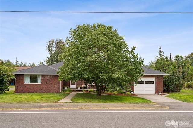 4421 89th Ave SE, Olympia, WA 98501 - view of front facade with driveway, a shingled roof, an attached garage, brick siding, and a front lawn