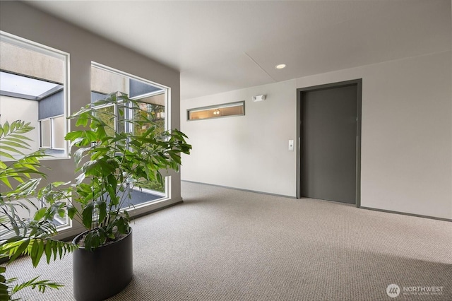 carpeted spare room with recessed lighting