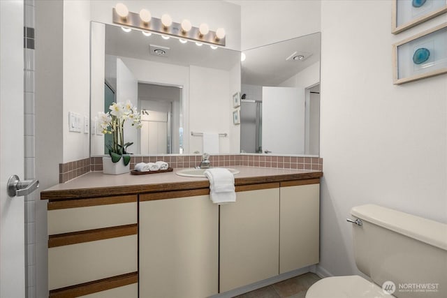 bathroom with toilet and vanity