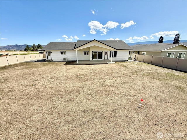2575 1st St SE, East Wenatchee, WA 98802 - back of house with a patio area and a fenced backyard