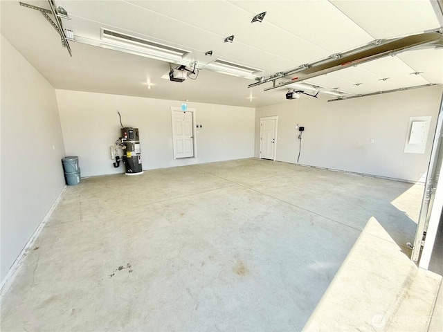 2575 1st St SE, East Wenatchee, WA 98802 - garage with a garage door opener and secured water heater