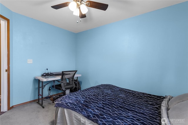 carpeted bedroom with baseboards and ceiling fan