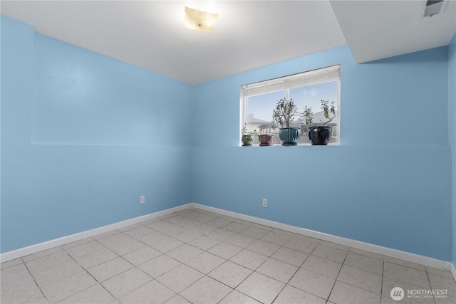 empty room with visible vents and baseboards