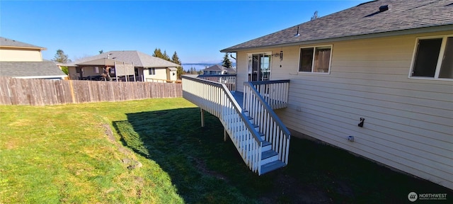 view of yard featuring stairs, fence, and a wooden deck