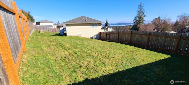 view of yard featuring a fenced backyard