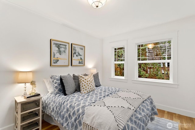 3657 23rd Ave W, Seattle, WA 98199 - bedroom featuring wood finished floors and ornamental molding