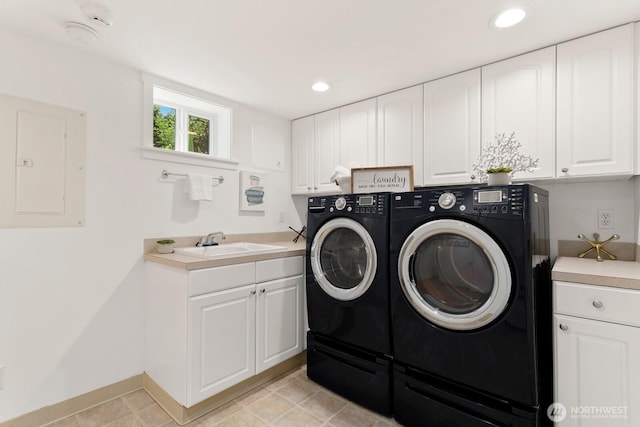 3657 23rd Ave W, Seattle, WA 98199 - washroom with electric panel, washer and clothes dryer, cabinet space, and recessed lighting