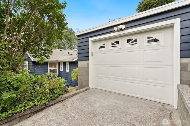 3657 23rd Ave W, Seattle, WA 98199 - garage featuring asphalt driveway