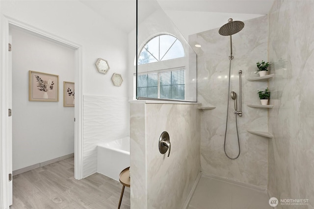 full bathroom featuring a tub, vaulted ceiling, walk in shower, and wood finished floors